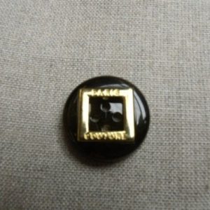 bouton acrylique garnit métal noir et or,23 mm,de belle qualité