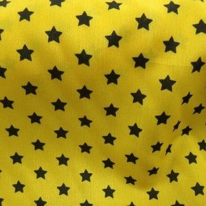 Tissu crêpe jaune en forme d'étoile noir