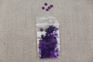 SEQUIN en forme d' étoiles métallisées - violet