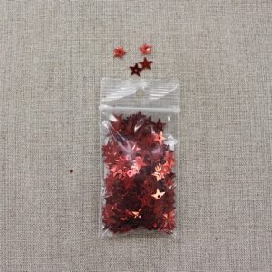 SEQUIN en forme d' étoiles métallisées - rouge