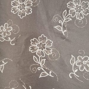 tissu polyester noir stretch avec imprimé fleur grise avec incrustation lurex or